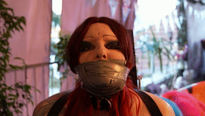 www.bondagecrossdresser.com - Helpless bound on the Bondage Chair with a tight Tapegag thumbnail