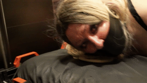 www.bondagecrossdresser.com - Locked Leather Hogtie on the Bondage Bed thumbnail